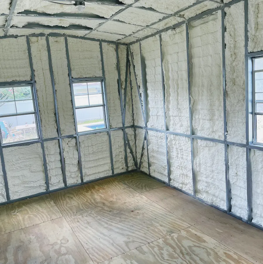 Closed-cell spray foam insulation applied to wall cavities in a residential project in Alexandria